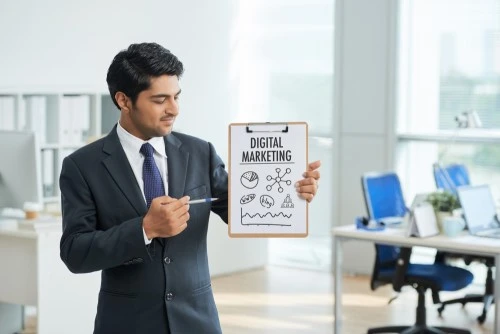 man in suit standing at office explaining digital marketing